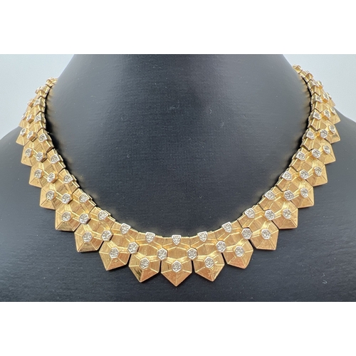 1065 - A vintage gold tone Cleopatra style collar necklace By D'Orlan. With geometric shaped brushed gold e... 