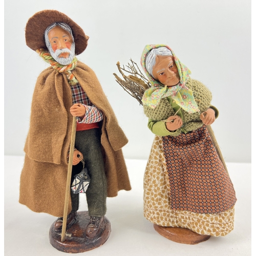 1266 - A pair of vintage Santon de Provence clay figurines with fabric clothing, both signed to base. Talle... 