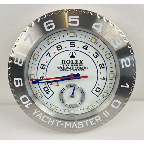 1255 - A modern battery operated brushed aluminium wall clock in the style of a Rolex yacht master watch fa... 