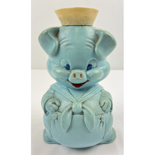 1312 - A vintage 1960's moulded pale blue plastic Porky Pig money box, containing a small amount of vintage... 