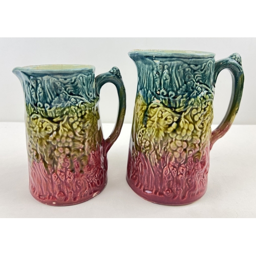 1259 - 2 vintage Majolica ceramic jugs with grape and vine decoration. In graduating colours of teal, lime ... 