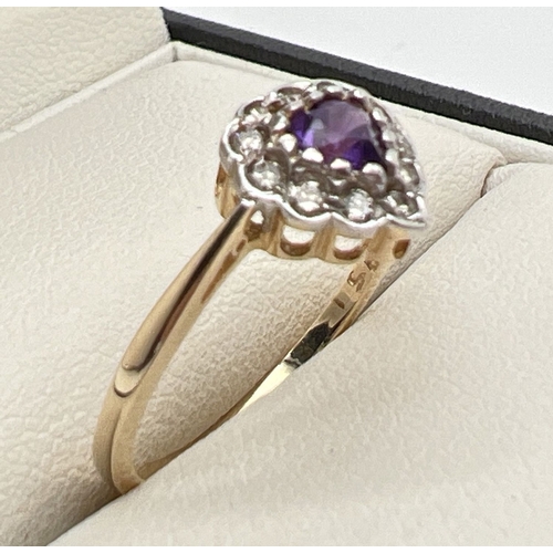 1011 - A 9ct gold heart shaped amethyst and diamond ring. Central amethyst haloed by 11 small round cut dia... 