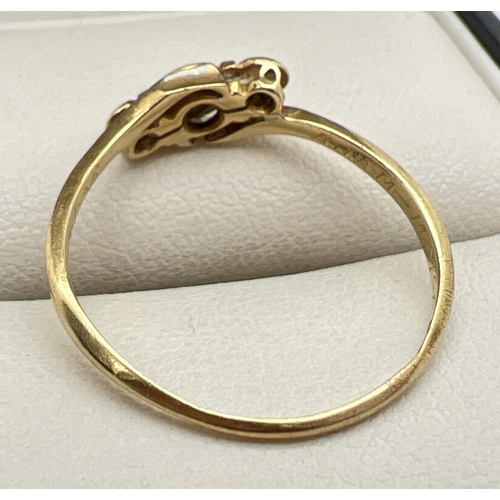 1009 - A 1930's 18ct gold, platinum and diamond twist design ring set with 3 small diamonds. Ring size S. W... 