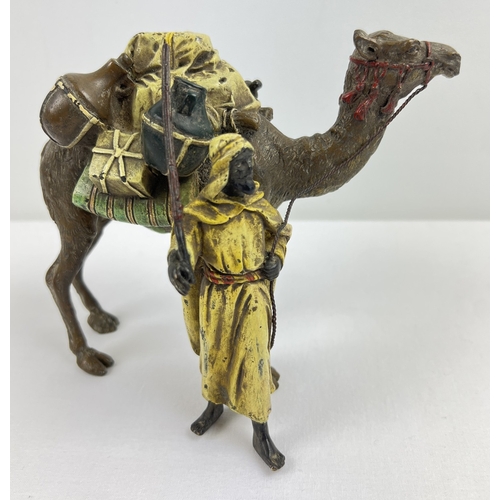 1225 - After Franz Bergmann - a cold painted bronze figure modelled as an Arab with his camel. Approx. 13cm...