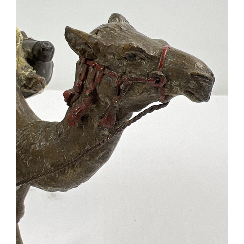 1225 - After Franz Bergmann - a cold painted bronze figure modelled as an Arab with his camel. Approx. 13cm... 