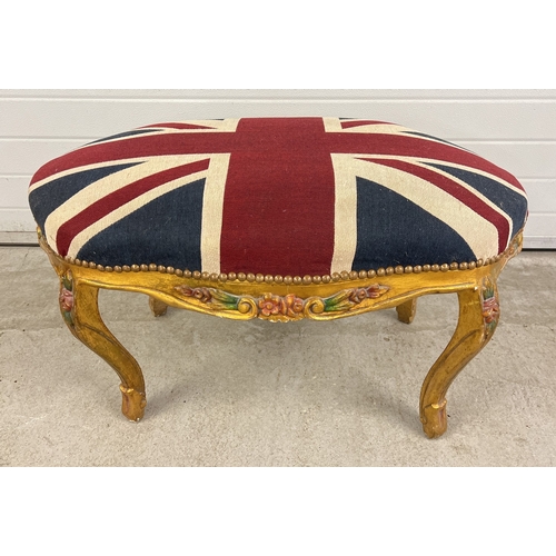 1368 - A large gilt plaster framed stool with painted floral detail and Union Jack cushioned upholstery sea... 