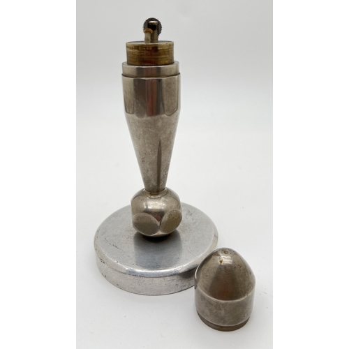 1325 - A vintage aluminium table lighter with lift off lid. Approx. 16cm tall.