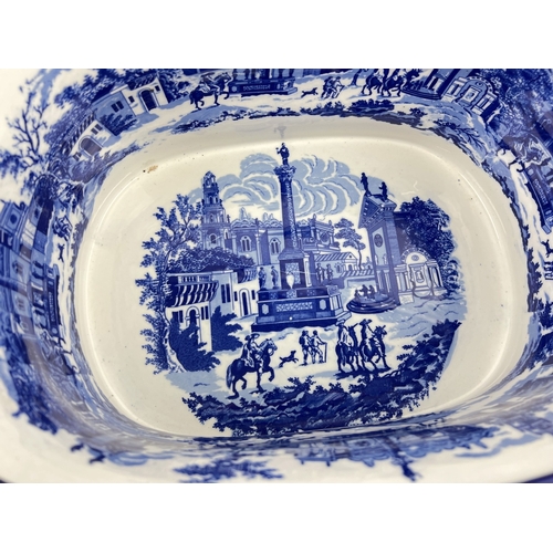 1271 - 2 large blue & white ceramic foot baths decorated with Victorian urban scenes. Largest approx. 20cm ... 