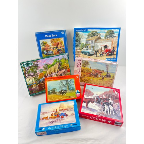 125A - 7 assorted boxed jigsaw puzzles of rural scenes featuring tractors, to include Gibsons & Falcon. All... 