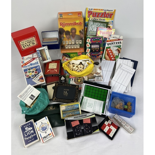 130 - A box of assorted games, cards and card game accessories. To include Rummikub, Yahtzee, pocket Roule... 