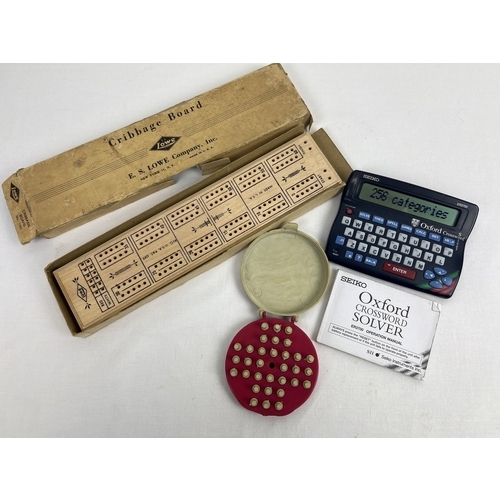 132 - A Seiko ER3700 Oxford Crossword Solver with instruction booklet. Together with vintage Solo pocket s... 