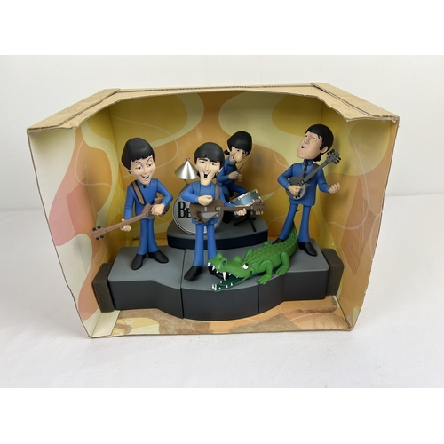 143 - A Deluxe Boxed Set The Beatles by McFarlane Toys. Characters are based on the 1965 animated TV serie... 