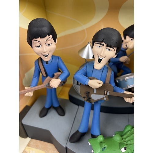 143 - A Deluxe Boxed Set The Beatles by McFarlane Toys. Characters are based on the 1965 animated TV serie... 