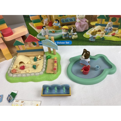 168 - A boxed Flair Toys Sylvanian Families Primrose Nursey Deluxe Set, play building, figures and accesso... 