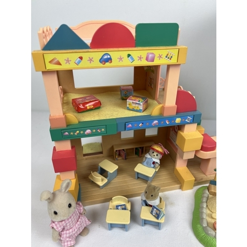 168 - A boxed Flair Toys Sylvanian Families Primrose Nursey Deluxe Set, play building, figures and accesso... 