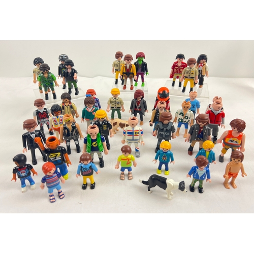 187 - A collection of 40 assorted Playmobile figures in varying outfits and sizes.