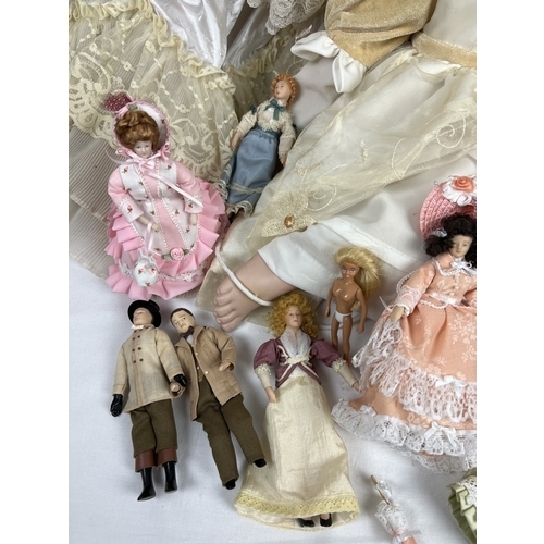 191 - A collection of vintage dolls to include 3 large soft bodied porcelain dolls. Also includes a very l... 