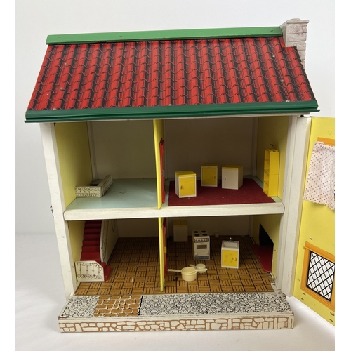 194 - A vintage wooden and plastic dolls house with front opening door, 4 rooms and a small selection of v... 