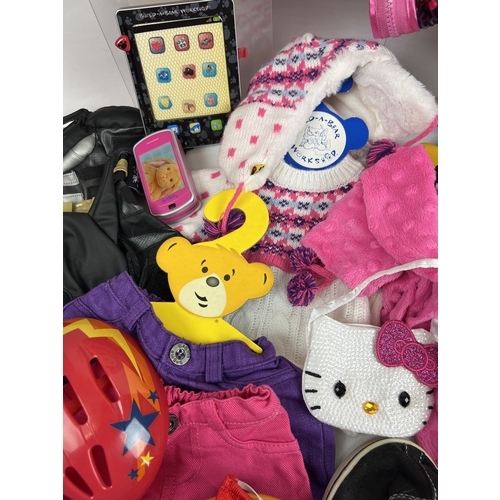 207 - A collection of assorted Build-a-Bear clothes, shoes and accessories to include Sketchers Twinkle To... 