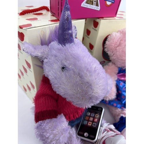 211 - 2 boxed Chad Valley DesignaBear plush toys with clothing and accessories. A purple sparkly unicorn a... 