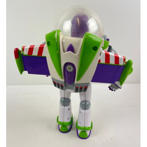 230 - A Disney Store Toy Story Buzz Lightyear figure by Thinkway Toys. Approx. 30cm tall.