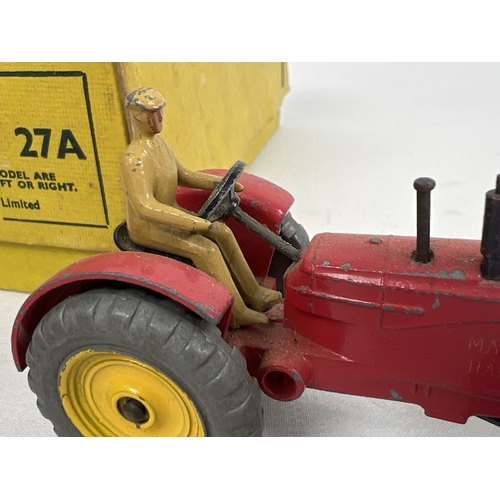 234 - A Dinky Toys No. 27A Massey-Harris Tractor original yellow card trade box with 3 examples. Red body,... 