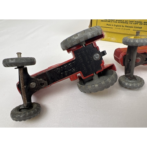 234 - A Dinky Toys No. 27A Massey-Harris Tractor original yellow card trade box with 3 examples. Red body,... 