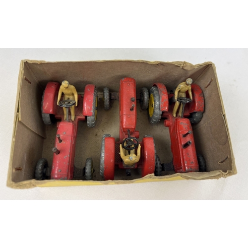 234 - A Dinky Toys No. 27A Massey-Harris Tractor original yellow card trade box with 3 examples. Red body,... 