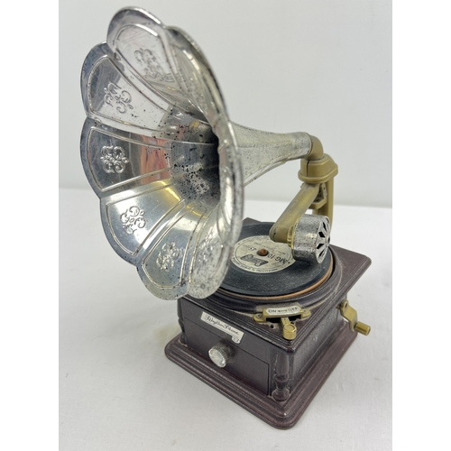 1050 - A vintage Rhythm Phone musical jewellery box modelled as a gramophone, with a small collection of vi... 