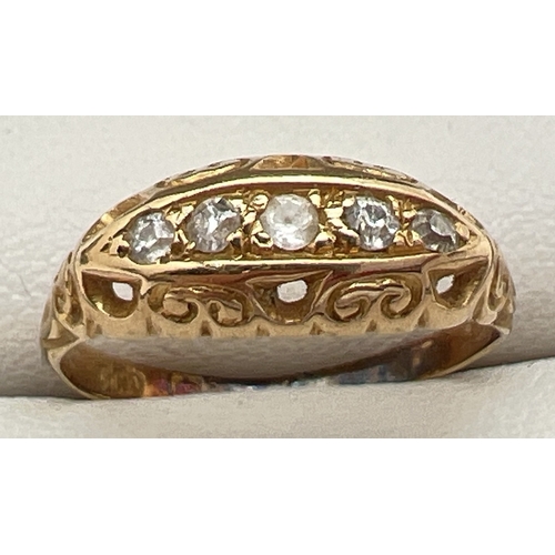 1079 - A vintage 9ct gold 5 stone diamond ring with decorative pierced design mount. Hallmark inside band i... 