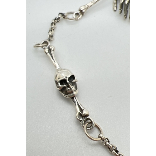 1116 - A modern steampunk design albert chain of skull and bones design, with hinged opening skull pendant,... 