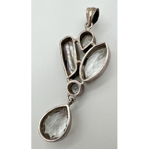 1142 - A large modern design silver pendant set with clear quartz, moonstone and a Keshi pearl. A marquise,... 