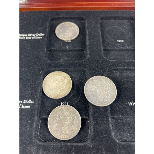 1218 - A wooden U.S. silver dollar collectors case with 9 Morgan Dollars for various dates and mints. San F... 