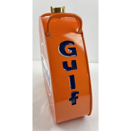 1237 - A triangular shaped painted metal Gulf oil can with bras screw top lid. Approx. 34cm tall.