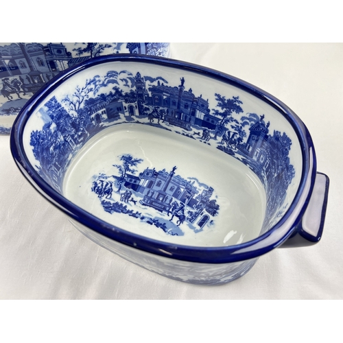 1271 - 2 large blue & white ceramic foot baths decorated with Victorian urban scenes. Largest approx. 20cm ... 