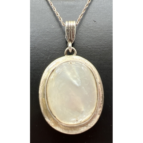 1029 - 2 silver and shell pendant necklaces on silver chains. A Square abalone shell pendant with silver ca... 