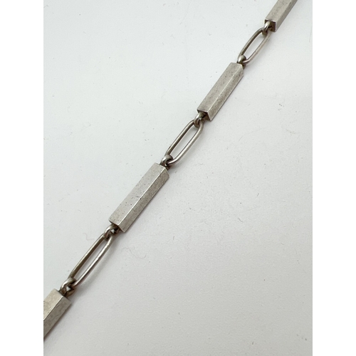 1003 - A modern Danish silver rectangular and oval link  bracelet by Arne Johansen. With T Bar clasp. Appro... 