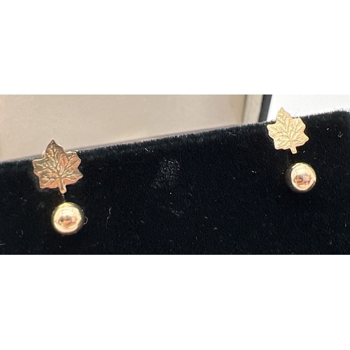 1049 - 3 pairs of unmarked gold stud style earrings. A pair of ball studs, a pair of flowers each set with ... 