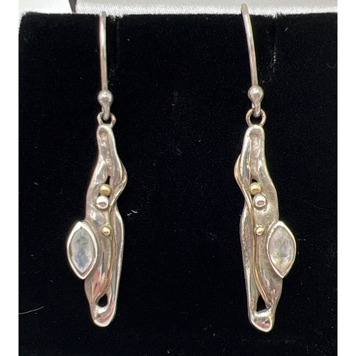 1054 - 3 pairs of silver drop style earrings. A modern design pair set with cognac amber, an Art Nouveau st... 