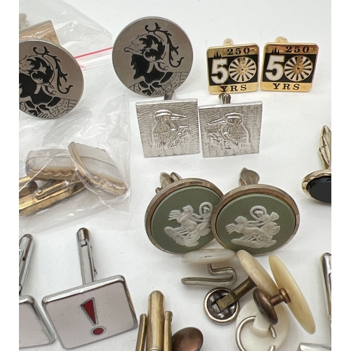 1067 - A collection of vintage and modern cuff links, shirt studs, tie pin and clips, in varying styles. To... 