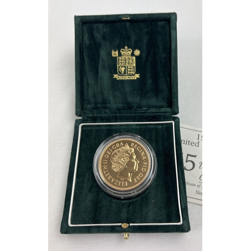 1218 - A boxed Royal mint limited edition 1998 22ct gold Brilliant Uncirculated £5 coin. No. 426/1000. St. ... 