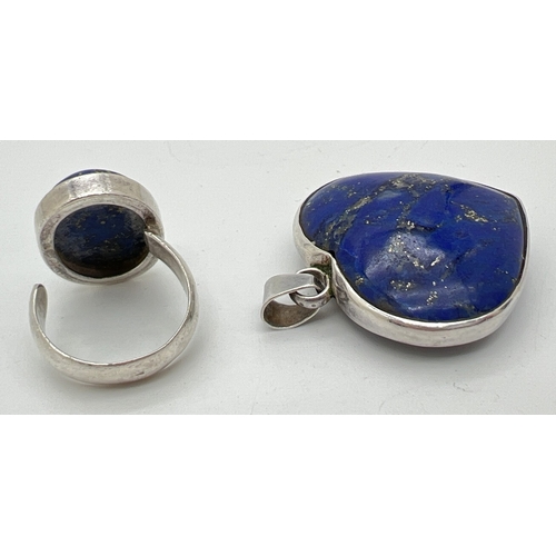 1072 - 2 pieces of Lapis Lazuli set jewellery. An adjustable size dress ring set with an oval cut stone and... 