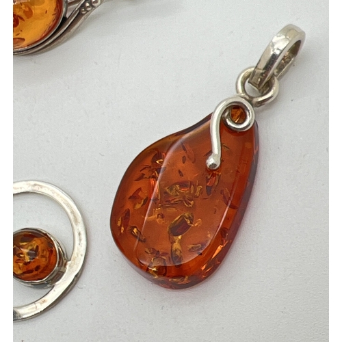 1081 - 3 items of Honey amber set silver jewellery. A brooch of an Art Nouveau style set with an oval amber... 