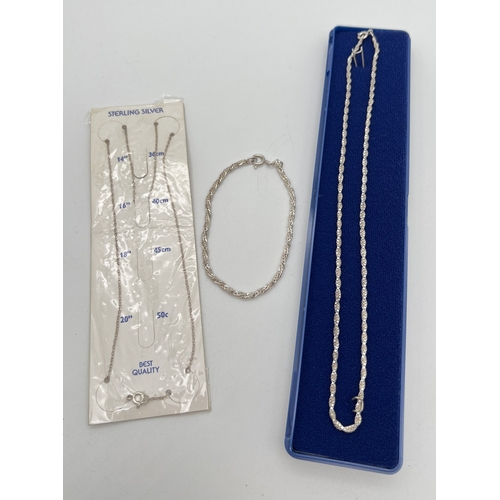 1093 - 2 silver chain necklaces together with a silver bracelet. A boxed 16