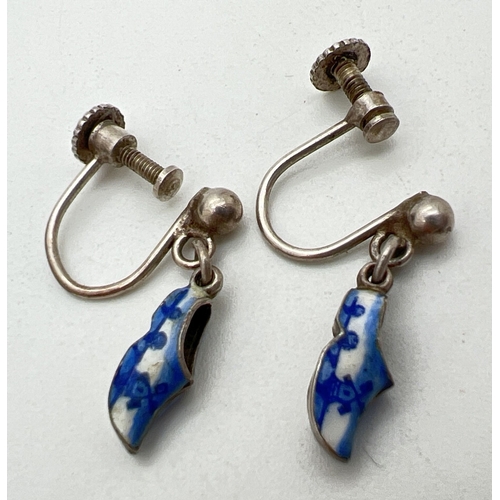 1096 - A pair of vintage Dutch white metal enamelled clog earrings with blue & white windmill designs. Scre... 