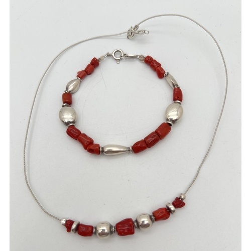 1101 - An Italian silver and red coral beaded necklace on a silver wire, with matching bracelet. Both stamp... 