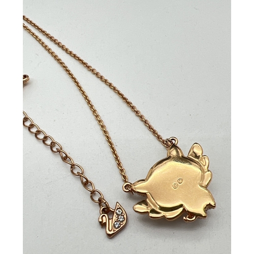 1105 - A Swarovski crystal set rose gold plated 'Little pig' fixed pendant necklace. On a 14