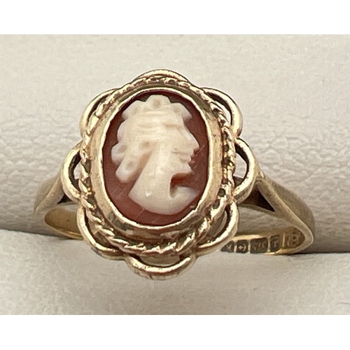 1119 - A small/child's 9ct gold cameo ring with oval shaped open work mount (approx. 1.1cm x 1cm). Fully ha... 