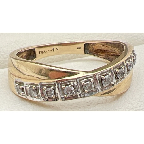 1120 - A 9ct gold and 12 point diamond eternity style ring with a twist design setting. 9 small round cut d... 