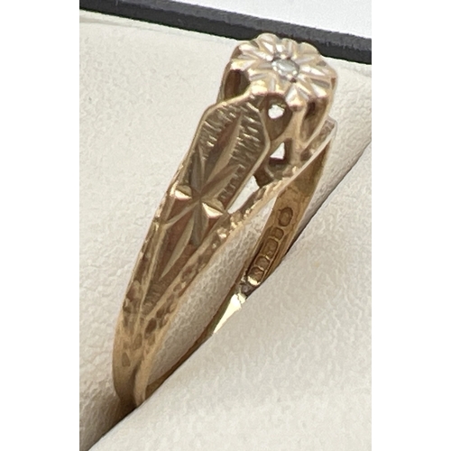 1123 - A 9ct gold and diamond solitaire ring with engraved detail to shoulders. Fully hallmarked inside ban... 